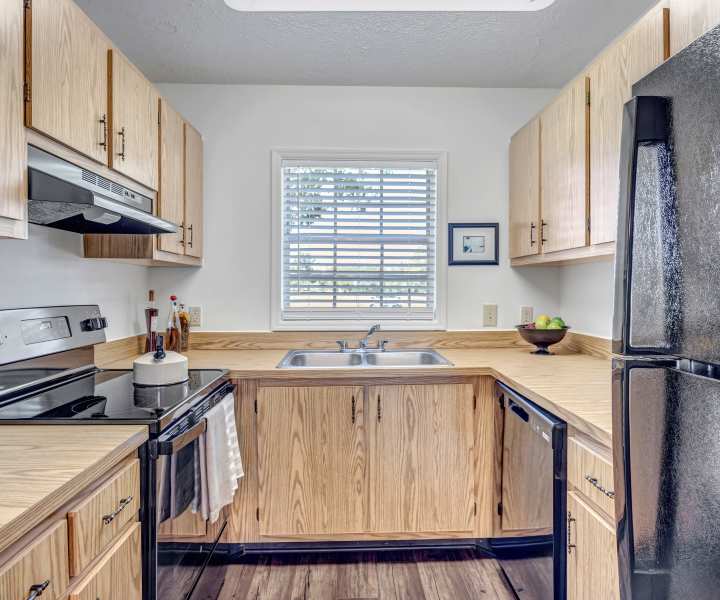 Interior of a modern apartment kitchen at Lake Carlton Arms in Lutz, Florida