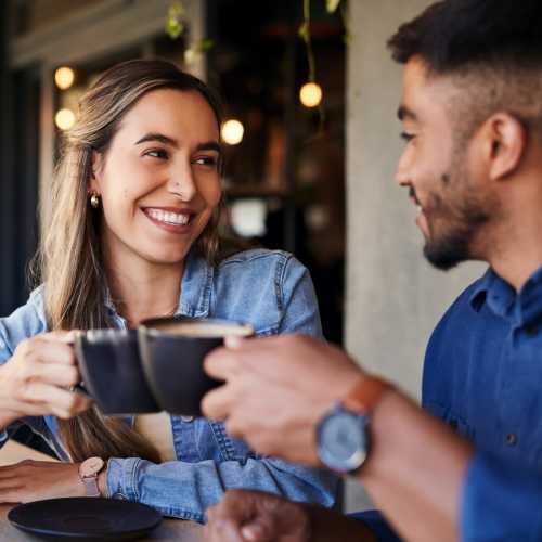 Couple enjoying their coffee time in a cafe near Village at Tradition in Port Saint Lucie, Florida