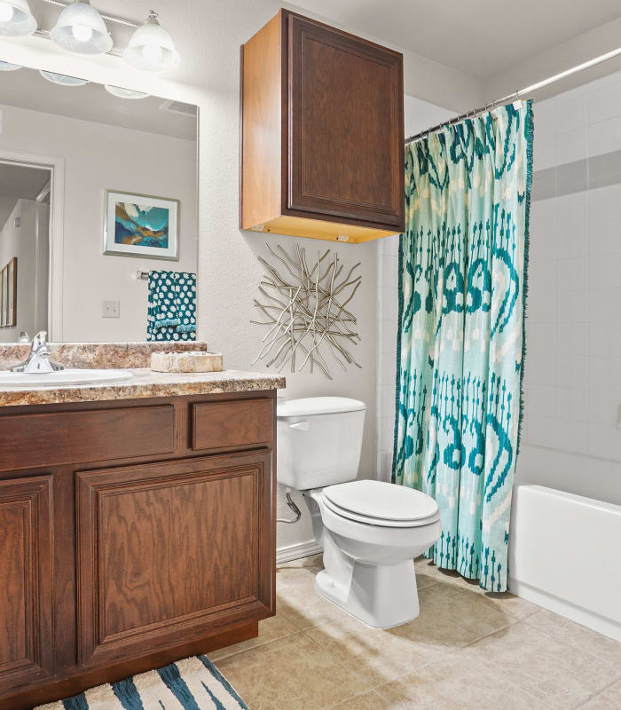 Bathroom with tile flooring at Tuscany Place in Lubbock, Texas