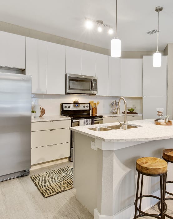 Modern kitchen with stainless steel appliances at Steele Creek in Jacksonville, Florida