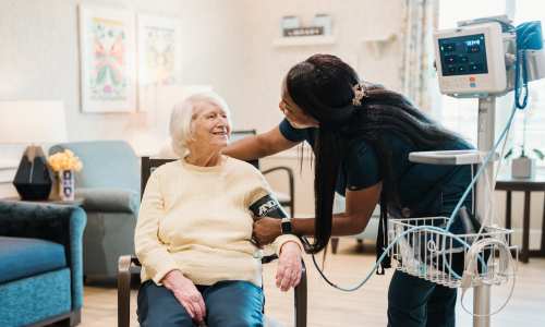 Nurse discussing medications with a resident at Barclay House of Augusta in Augusta, Georgia