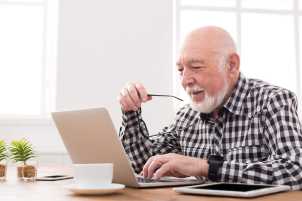 Residents working on his computer at WellQuest of Menifee Lakes in Menifee, California