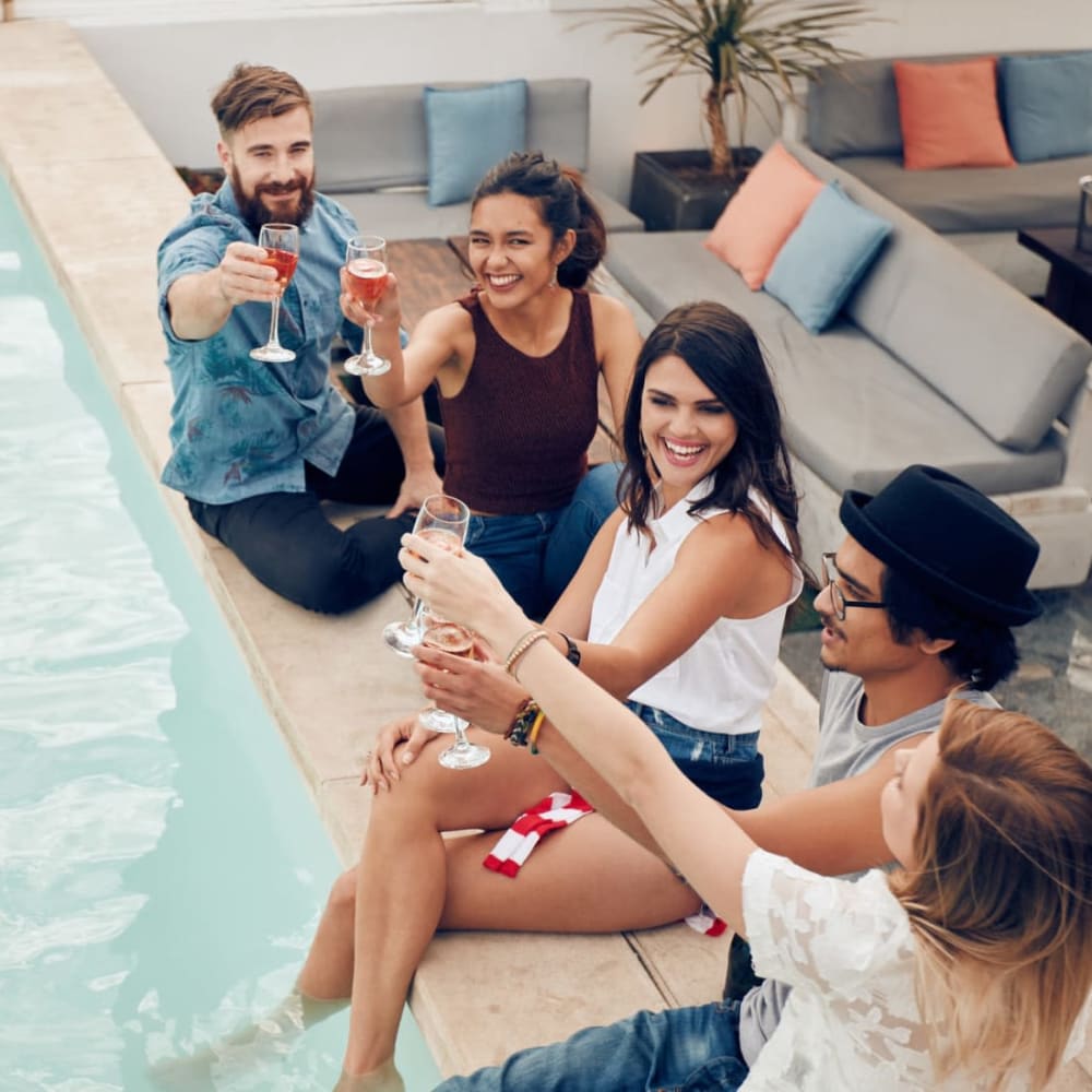 Residents raising a toast to the good life at the resort-style swimming pool at Abaco Key in Orlando, Florida