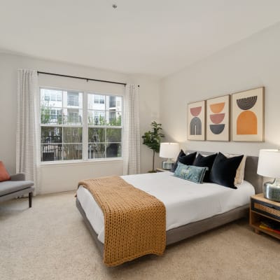 Bright bedroom with beige walls at Sofi Parc Grove in Stamford, Connecticut