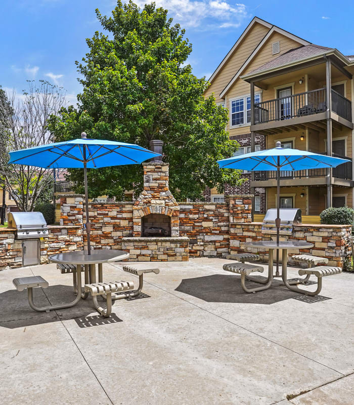 Outside grills and fireplace at Coffee Creek Apartments in Owasso, Oklahoma