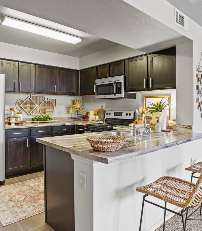 Kitchen with granite countertops at Park at Coulter in Amarillo, Texas