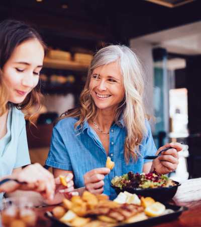 Residents eating lunch at a favorite restaurant near Athens Vista Senior Apartments in Los Angeles, California