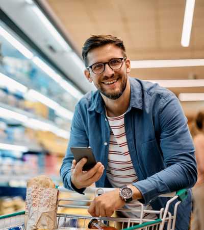 Resident shopping at supermarket near Adagio at Westshore Palms in Tampa, Florida