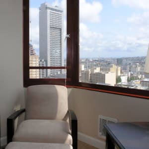 A corner nook with comfortable seating and a view in a model home at Tower 737 Condominium Rentals in San Francisco, California