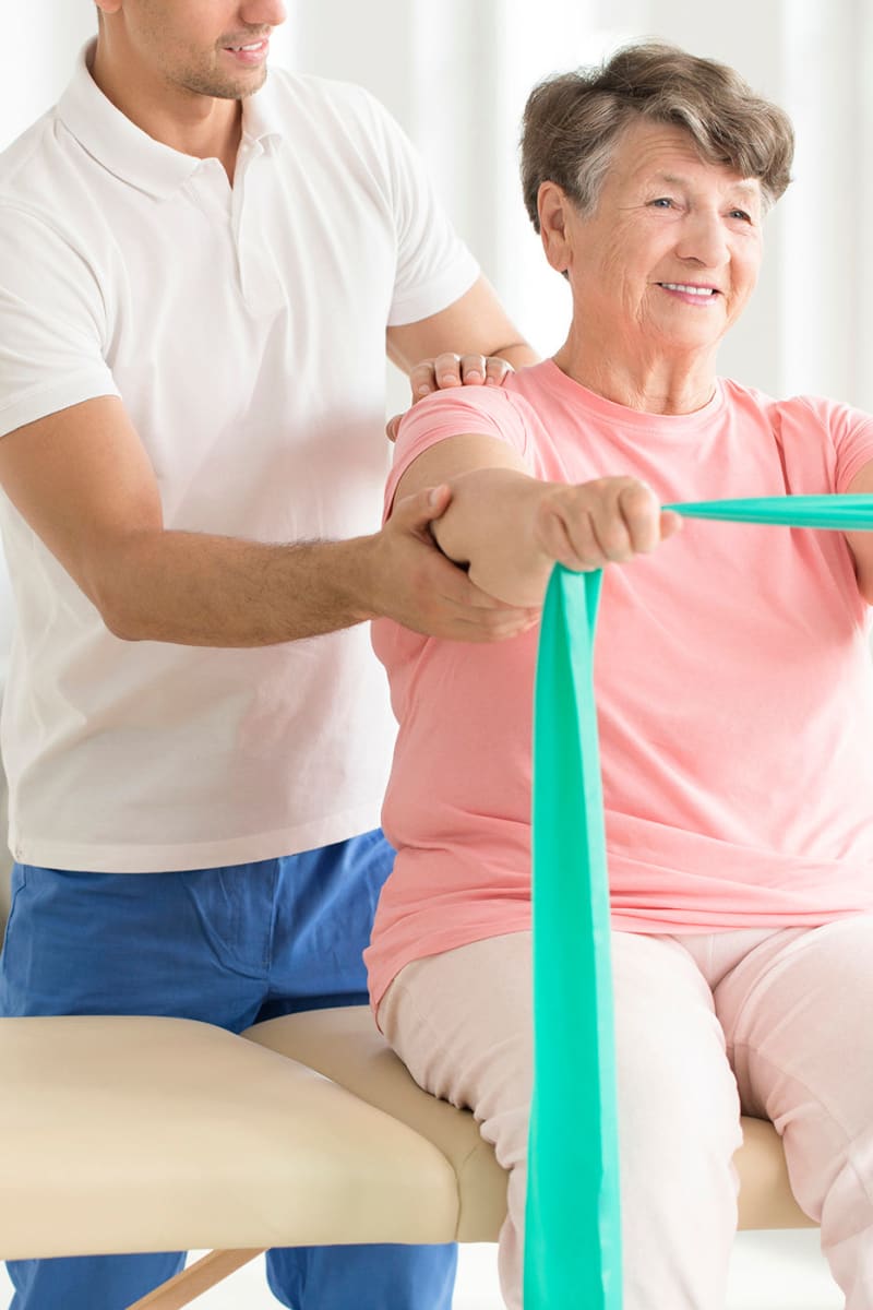 Resident working with an exercise band at Ingleside Communities in Mount Horeb, Wisconsin