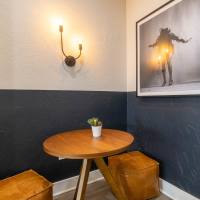 Cozy nook with round table and wall sconce at Sutton in Austin, Texas
