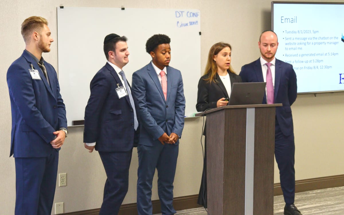 Team members presenting to a group at Harbor Group Management in Norfolk, Virginia.