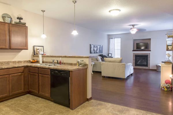 Apartment kitchen and living room at Ironwood in Altoona, Iowa