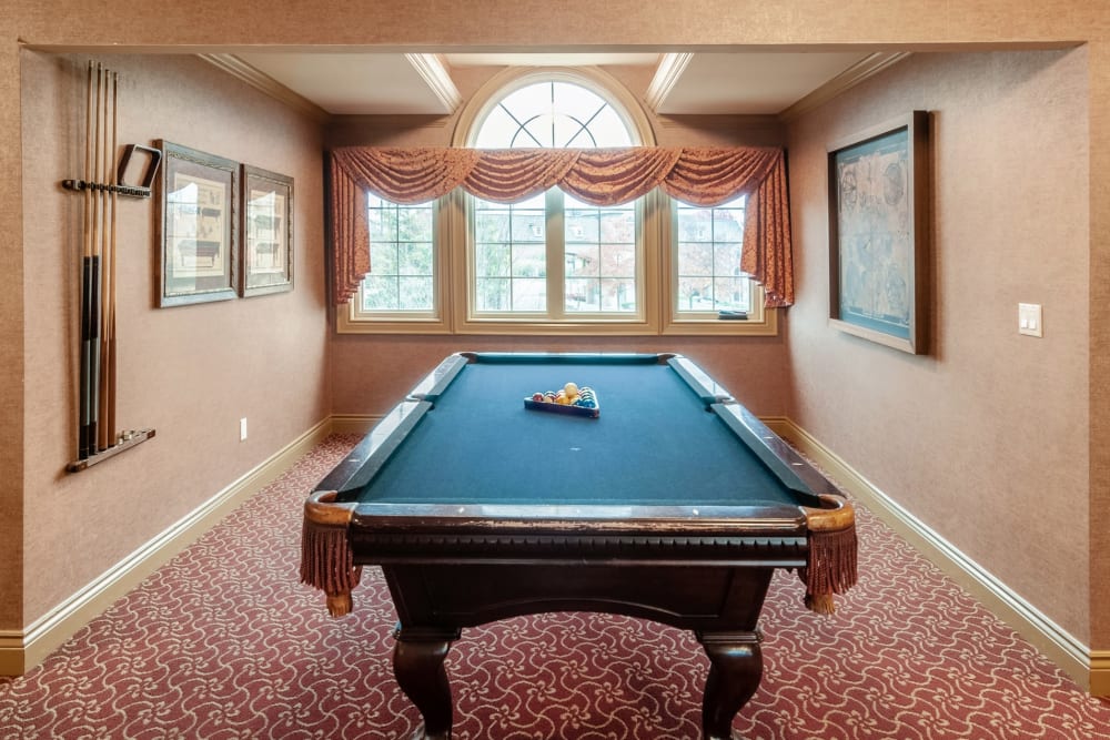A game room with billiard table at Central Park Estates in Novi, Michigan