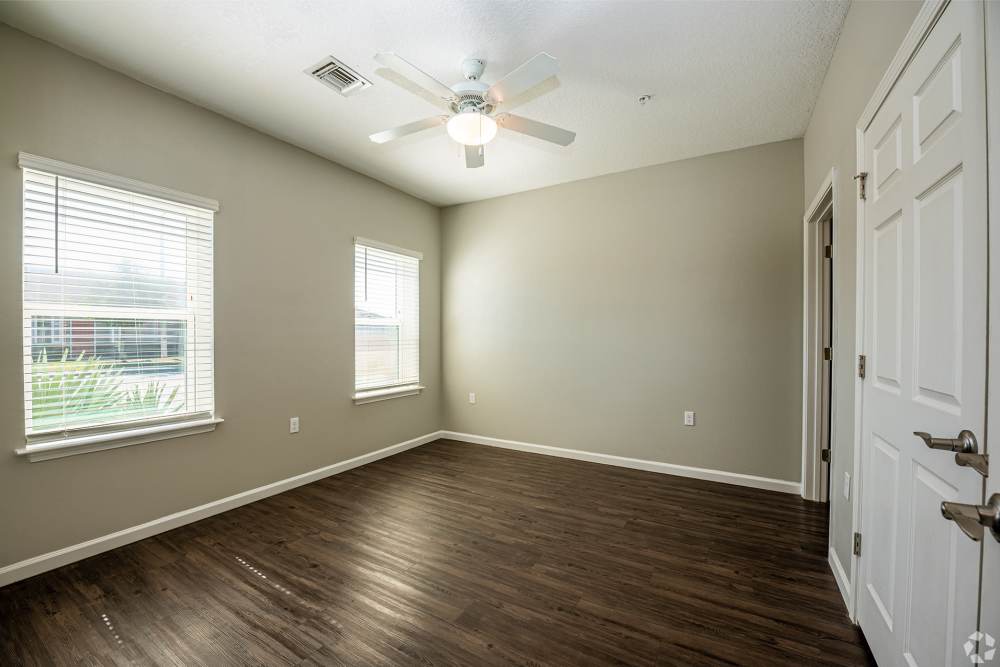 Cozy bedroom at Promenade at Grande Park in Spring Hill, Florida