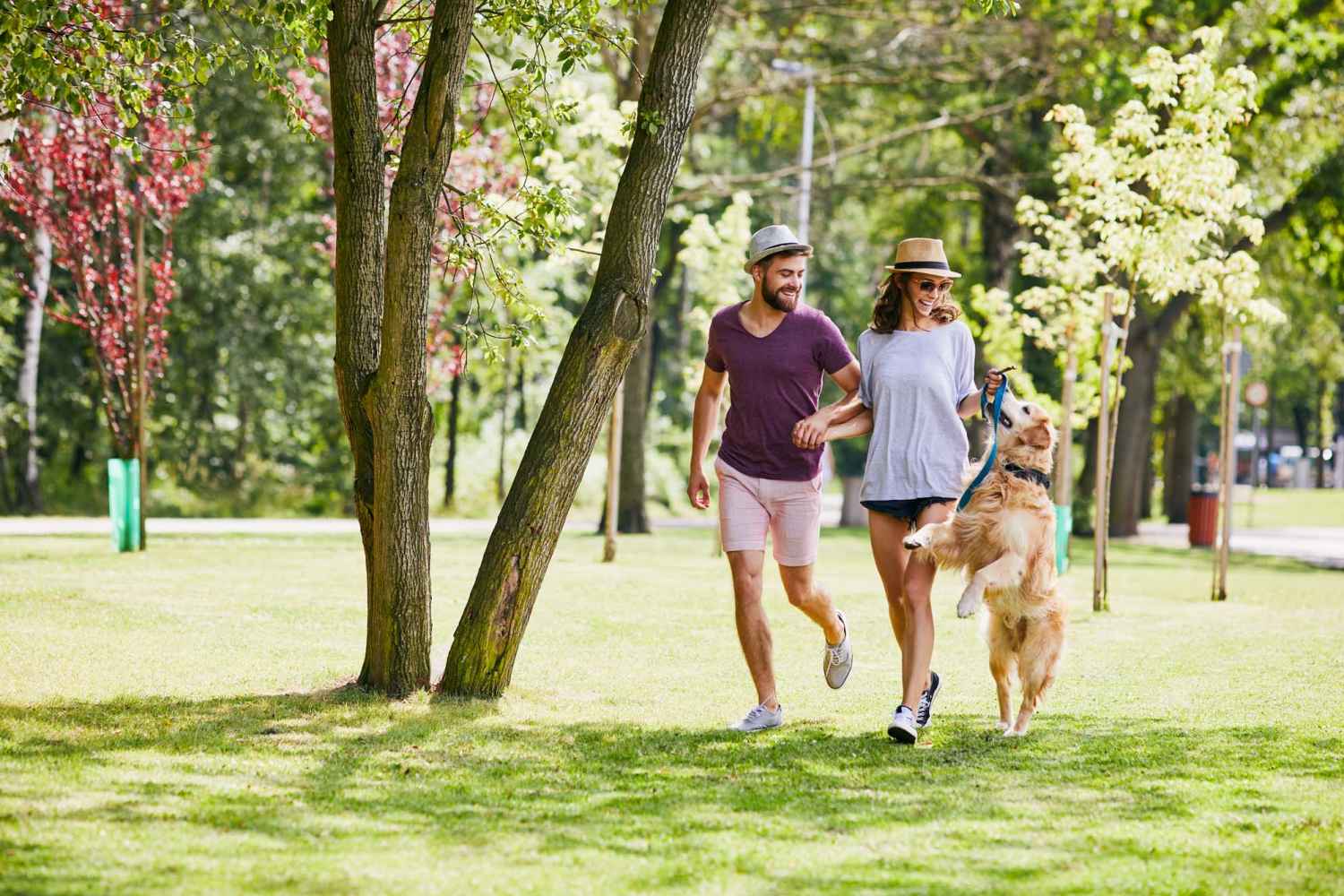 Residents and their pet dog on a walk in a park near Indian Terrace Villas in Auburn, Indiana