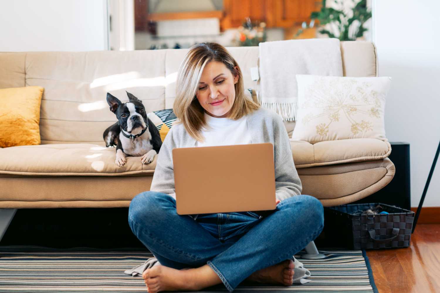 Resident working on her laptop in her apartment at School Street Villas in Brooklyn, Michigan