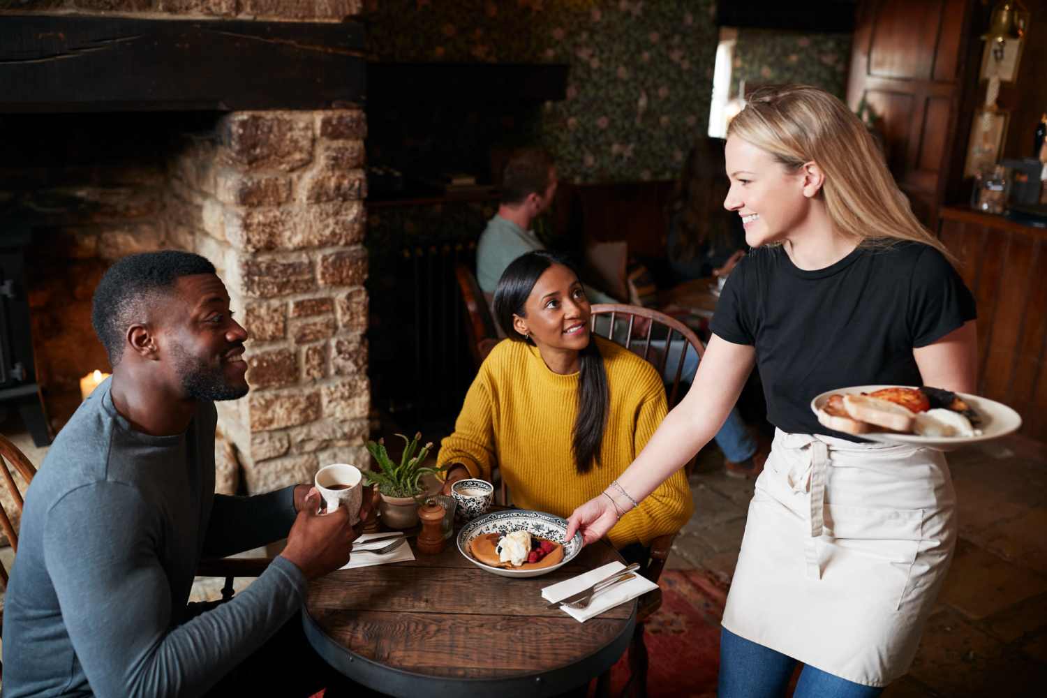 Residents eating in restaurant near Townsend Trace Apartments in Greensboro, North Carolina