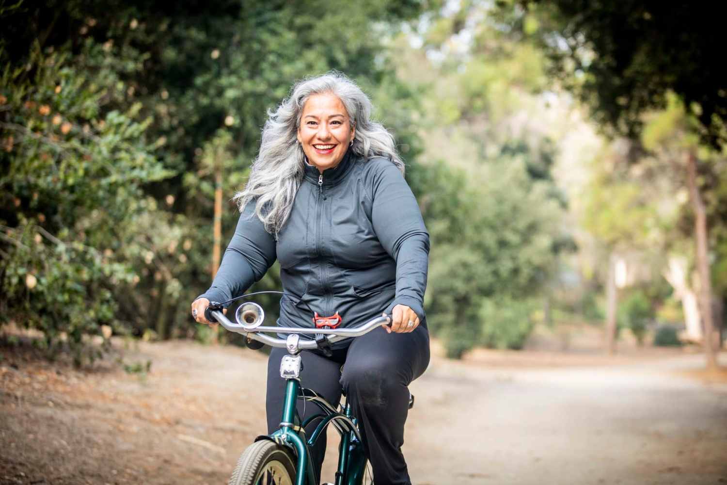 Senior resident cycling in a park near Capital Towers in Raleigh, North Carolina