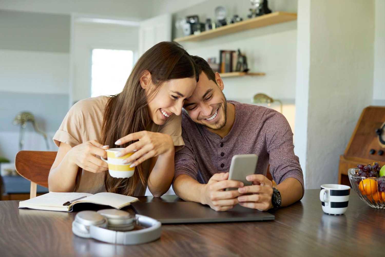 A happy couple surfing the net in their apartments at Village Apartments in Bellaire, Michigan