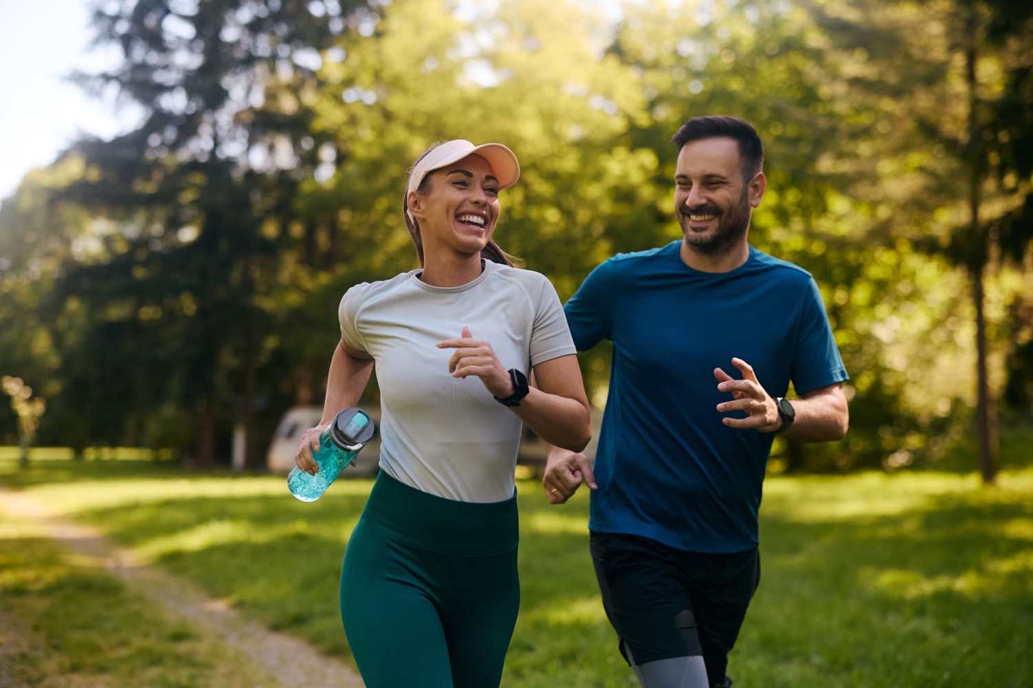A couple jogging in a park near Village Apartments in Bellaire, Michigan