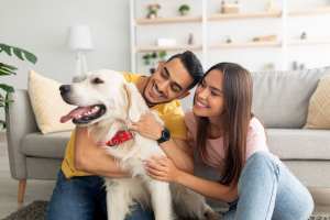 Resident couple playing with their dog at IC Creek Ranch in Leonard, Texas