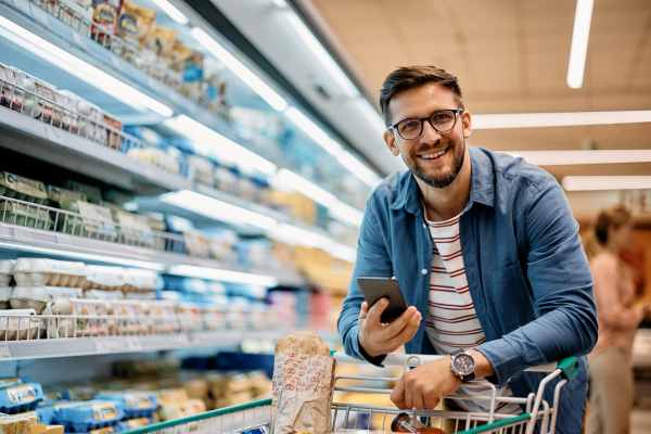 Man buying groceries at a shopping center near Indigo Springs in Mesa, Arizona