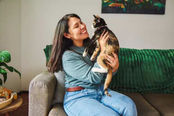 Happy resident and her cat at Truckee River Terrace in Reno, Nevada