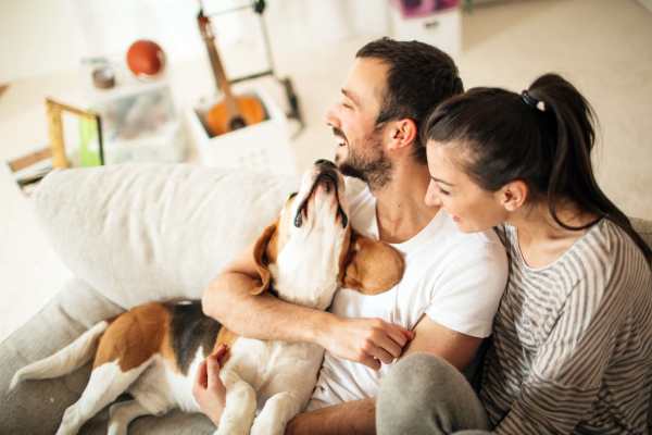 Happy residents and their pup at Stone Village Apartments in Reno, Nevada