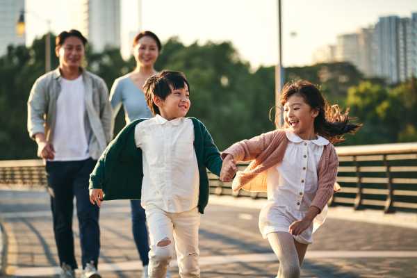 Happy family exploring neighborhood near Asheville at Spring Branch in Houston, Texas