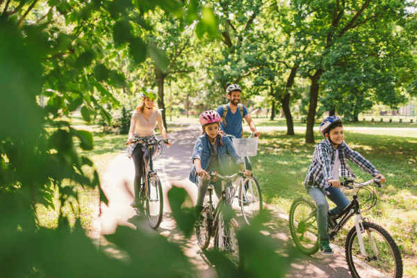 A happy family riding bikes near Alys in Conroe,Texas