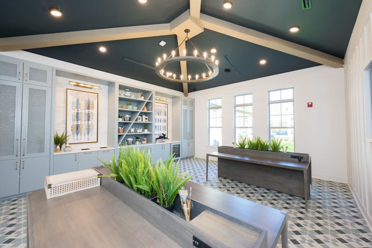 Indoor community area with tables and chandelier 