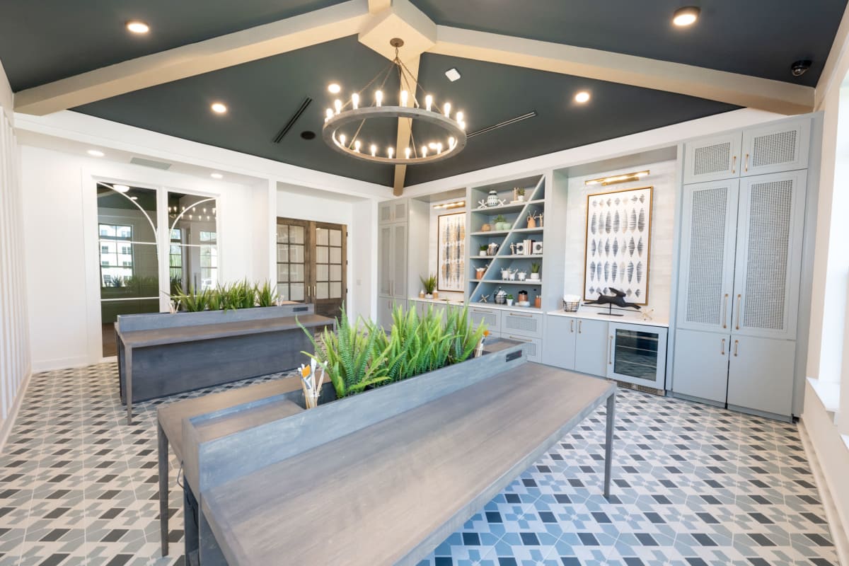 Indoor community area with tables and chandelier 