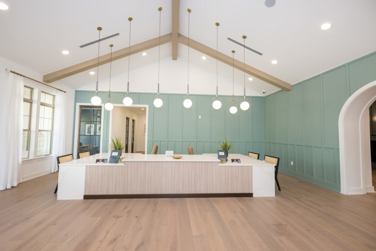 Indoor community area with high ceilings and cabinets