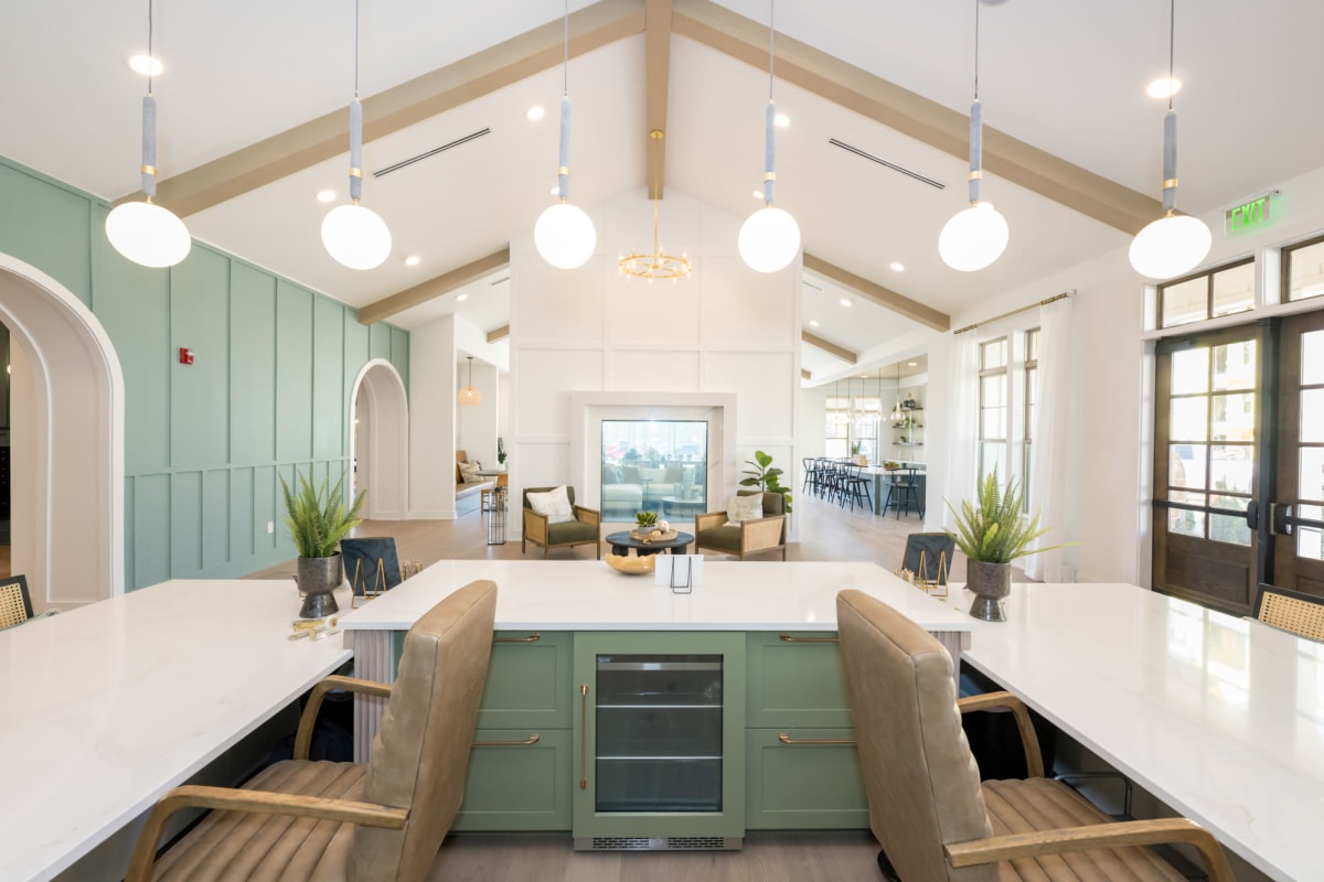 Indoor community area with high ceilings, cabinets and chairs