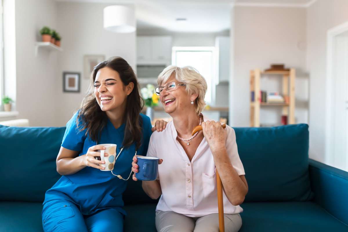 Staff member with a resident at Watermere on Oak Street in Roanoke, Texas.
