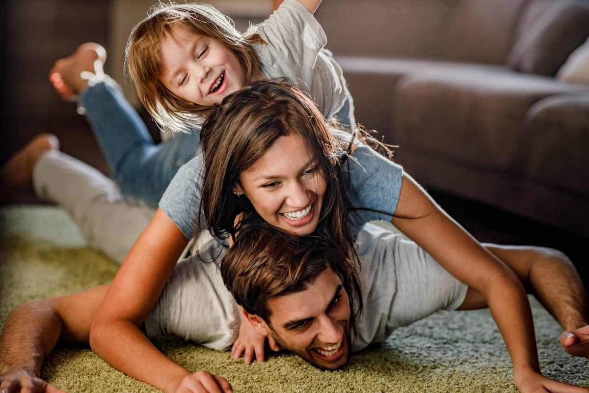 A happy family at The Retreat at Lake Johnson Apartments, Raleigh, North Carolina