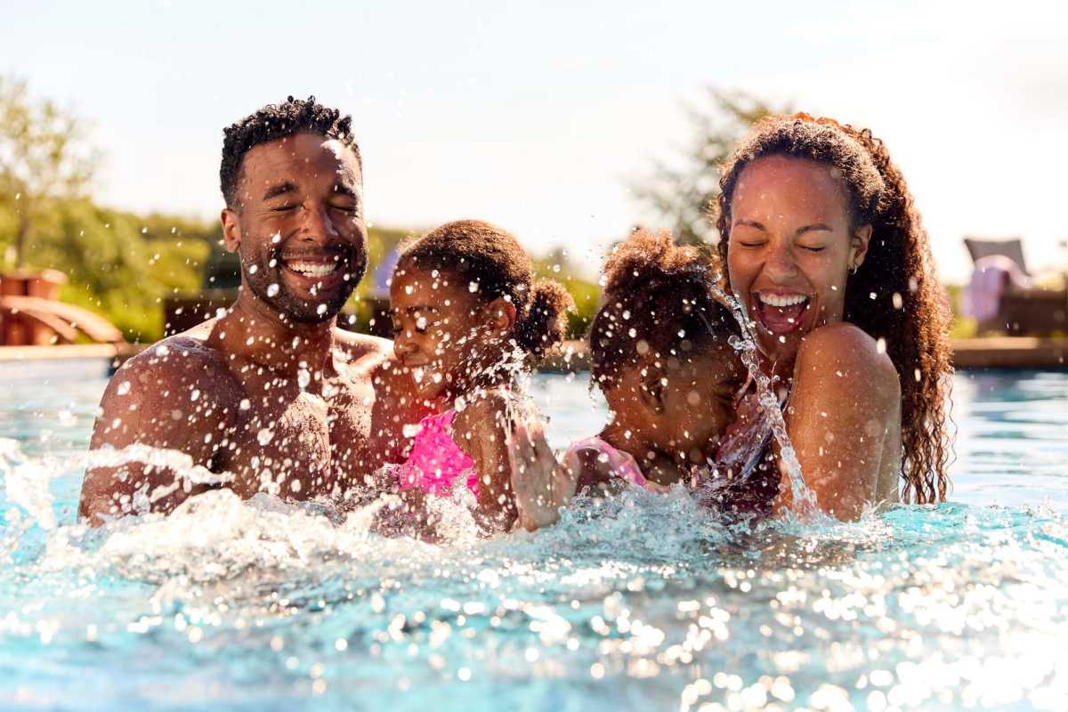A resident enjoys some pool time at The Retreat at Lake Johnson Apartments, Raleigh, North Carolina