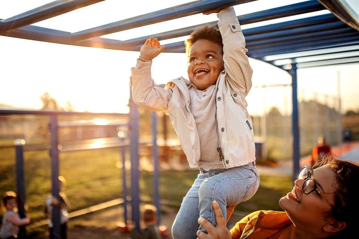 Resident kid having fun outside on a beautiful afternoon at Creekwood Apartments in Gainesville, Florida