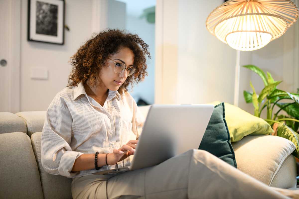 Resident looking at laptop at Cable Ranch in San Antonio, Texas