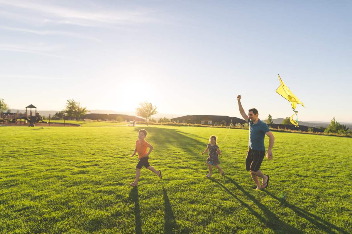  Resident family playing near Brazoswood Apartments in Clute, Texas