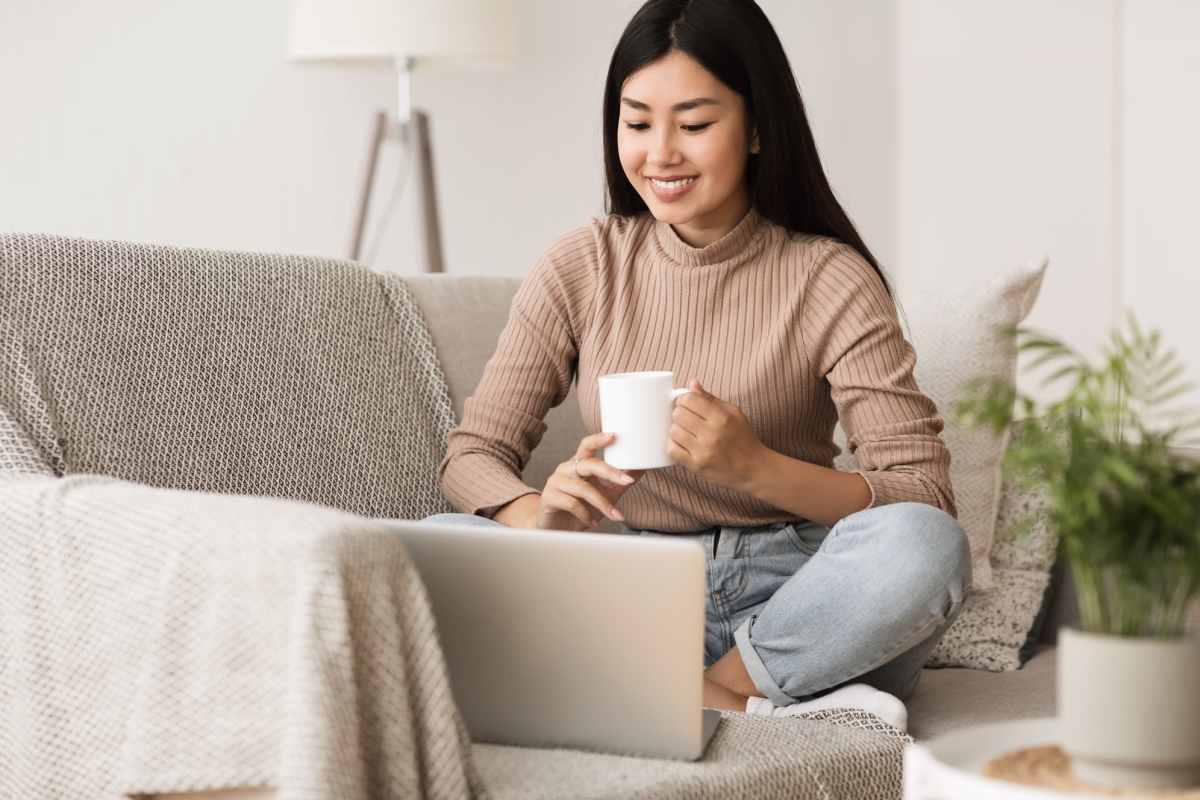 Resident checking income restrictions on her laptop at Fairway Breeze in El Reno, Oklahoma