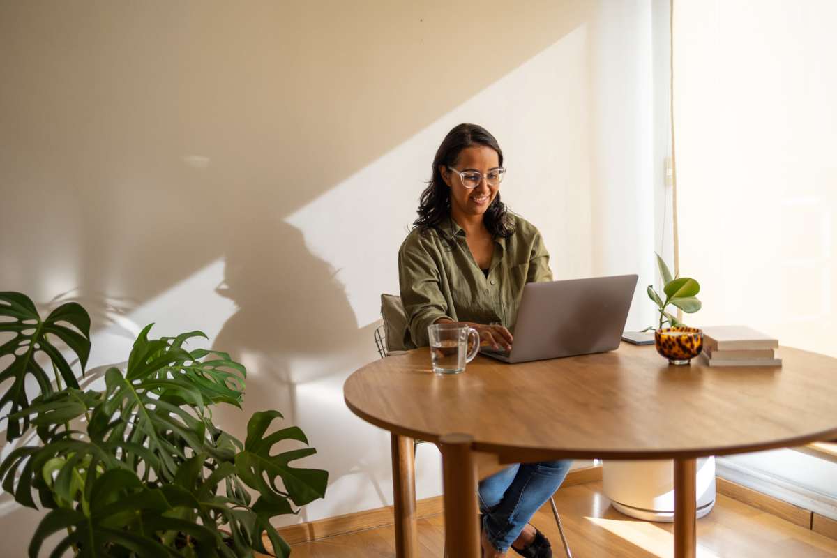 Resident woman working on her laptop at Harvest Park in Pampa, Texas