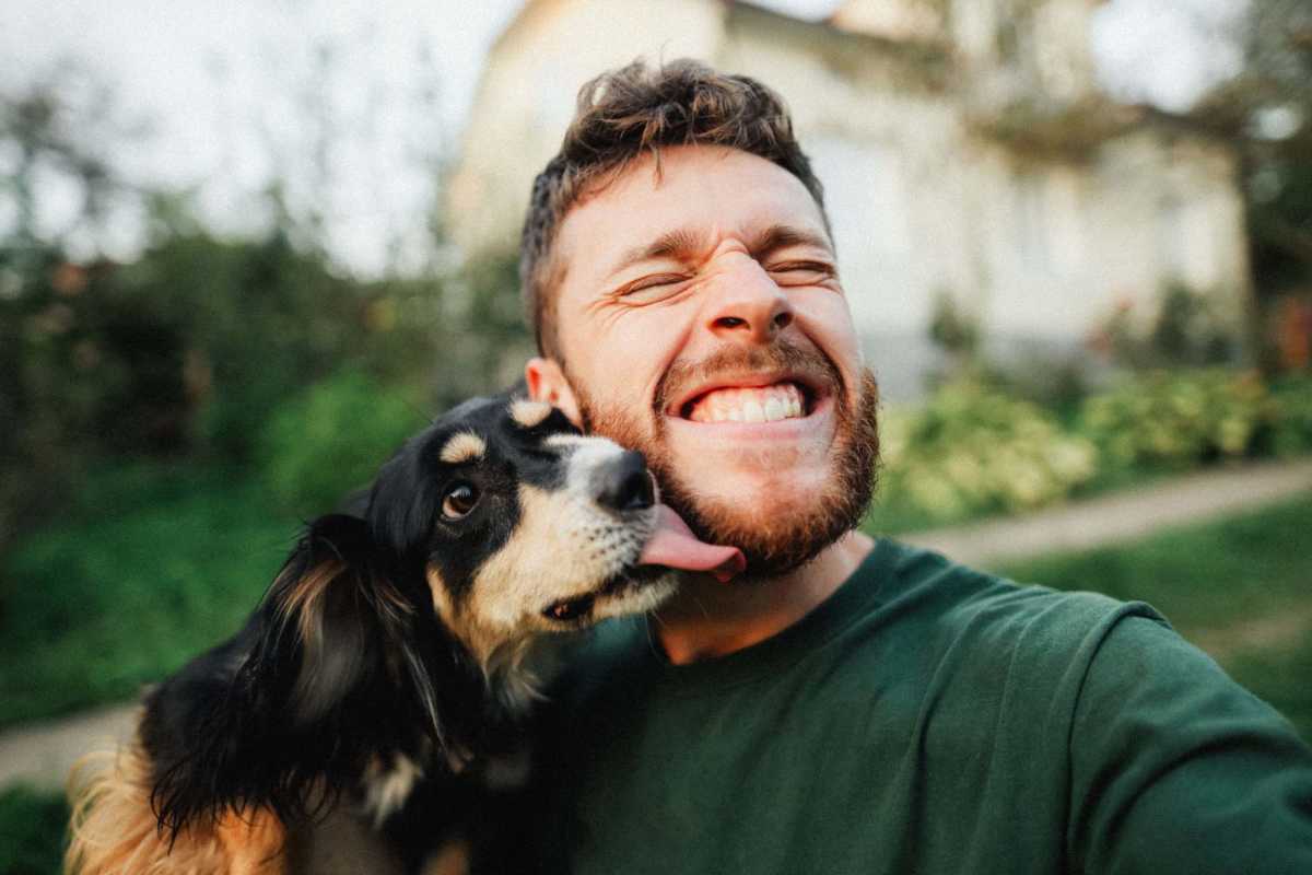Resident playing with his dog at Lexington Park in Ocean Springs, Mississippi