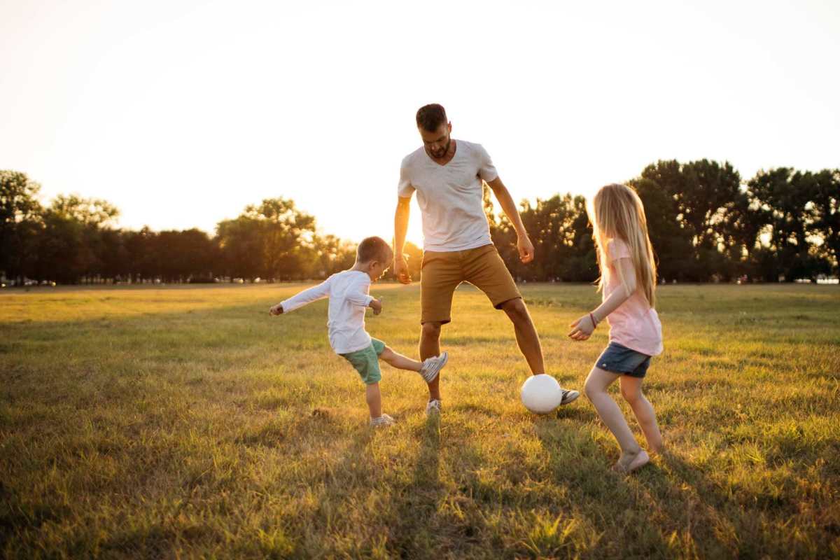  Resident playing with kids near Lexington Park in Ocean Springs, Mississippi