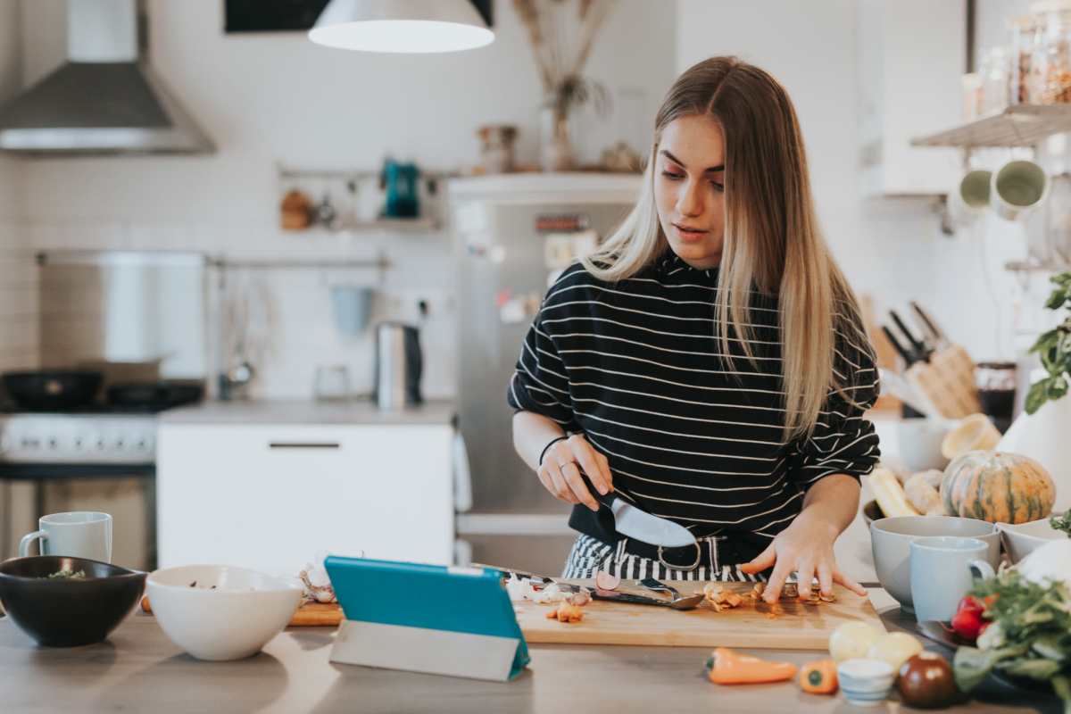  Resident chopping vegetables in the kitchen at Timber Village II in Marshall, Texas
