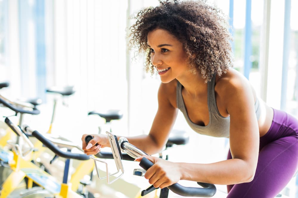 Rendering of resident in the fitness center at Raven South End in Charlotte, North Carolina