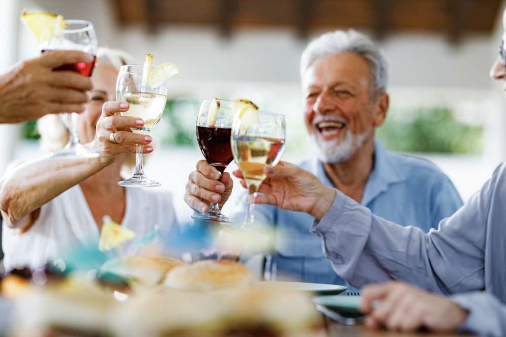 Residents clinking glasses at Watermere on Oak Street in Roanoke, Texas