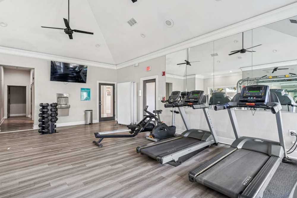 Large spacious bedroom with wood-style flooring at Benton in Dallas, Texas, 