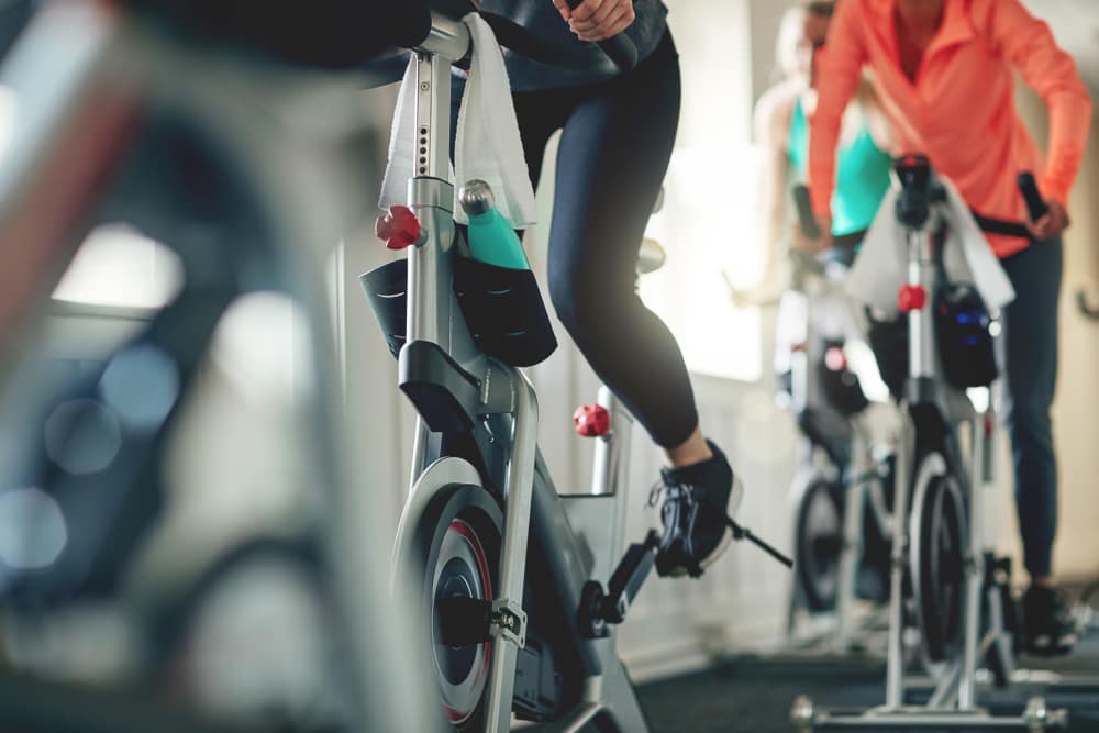 Indoor cycling bikes with riders at Straus Lofts in Saint Paul, Minnesota 